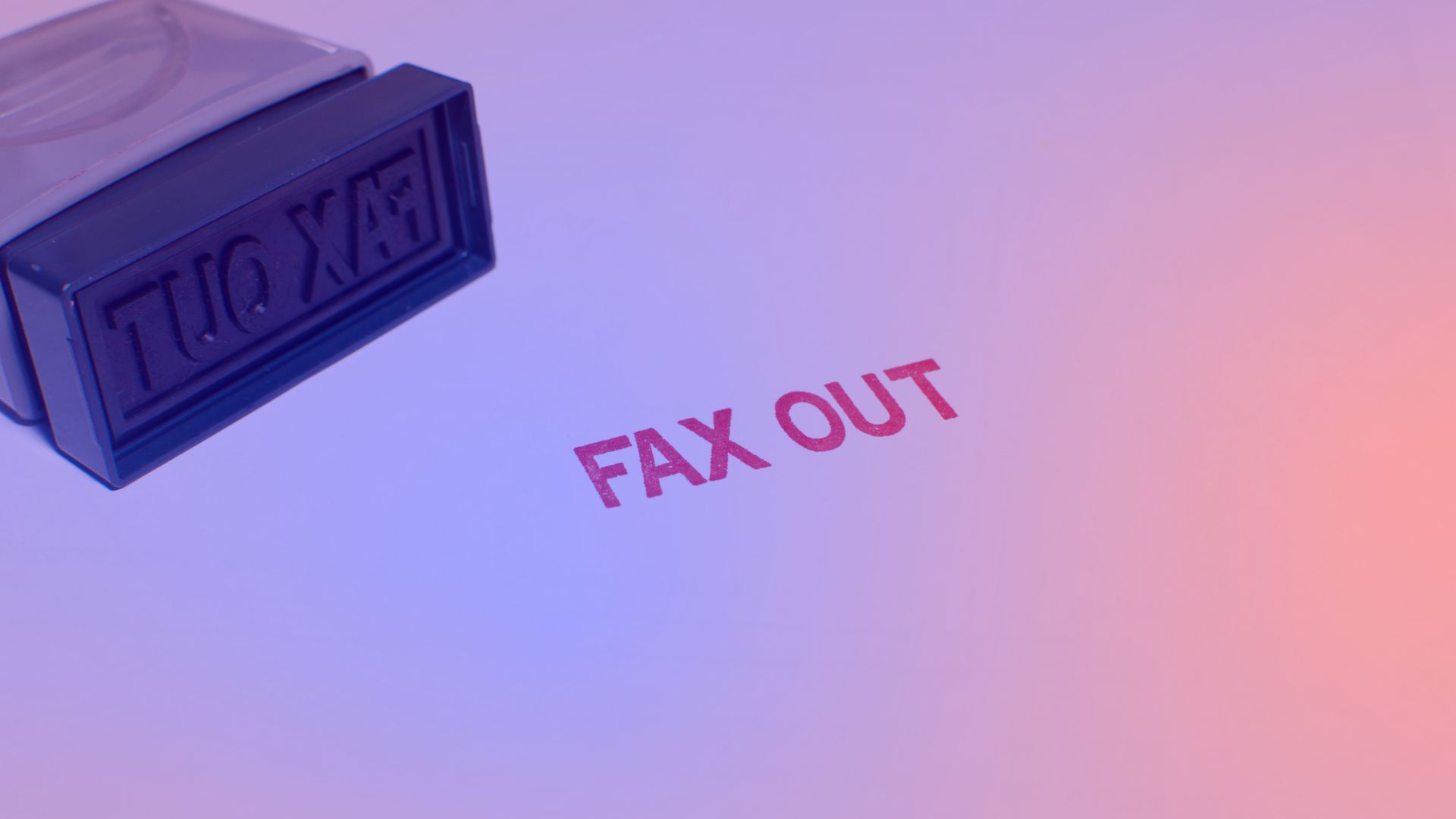 Stamp with the label “Fax Out” as a symbol of outdated processes – AI for SMEs as the way forward